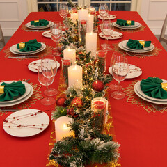 Beautiful table setting with Christmas decorations. Red colors