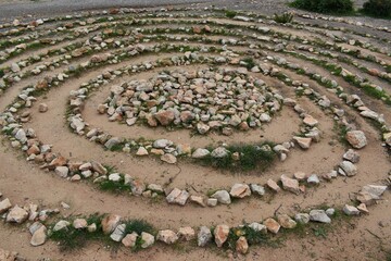 Fototapeta na wymiar A spiral of rocks in the coast of Ibiza