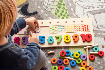 Baby toddler early development. Wooden stack and count rainbow colors learning game. Child learn...