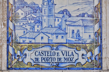 azulejos panel representing monuments and country scenes on the walls of Leiria station, Portugal..