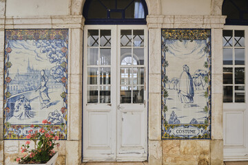 Fototapeta na wymiar azulejos panel representing monuments and country scenes on the walls of Leiria station, Portugal..