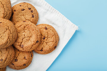 Oatmeal cookies on a napkin on a blue background