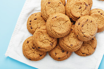 Oatmeal cookies on a napkin on a blue background