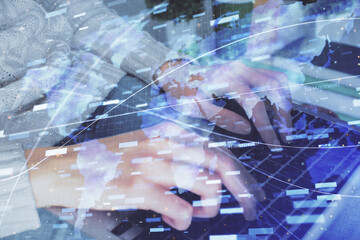 Double exposure of woman hands working on computer and data theme hologram drawing. Tech concept.