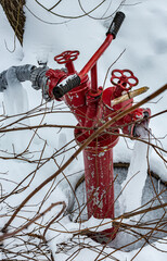 red fire hydrant with frozen water jet