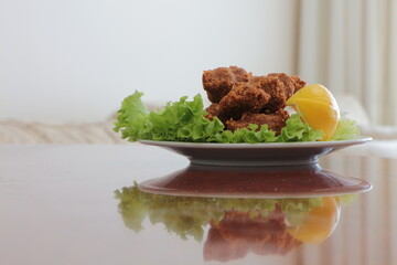Cig kofte,  Chee kofta, raw meatball, one of the most important dishes of Turkish cuisine. Cig kofte with lettuce and lemon. Traditional Turkish Raw Meat.