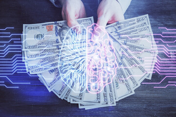 Multi exposure of brain drawing hologram and us dollars bills and man hands. Ai invest concept