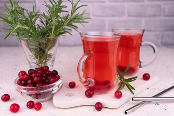 Festive cocktail of cranberries and rosemary. Alcoholic or non-alcoholic cocktail.