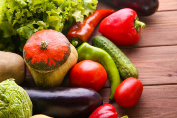 Vegetables on a wooden background. Healthy eating concept