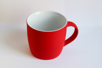 Blank red mug isolated on white background,mat tea or coffee cup,mock up with ceramic mug for hot drinks,empty gift print branding template,tankard for design,placement for logo.