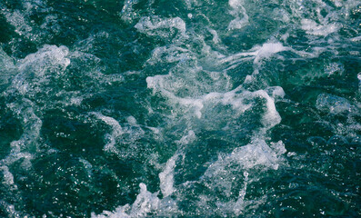 White crest of a sea wave. Selective focus. Shallow depth of field.