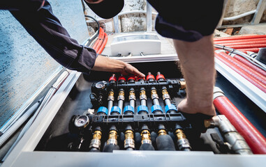 HVAC technician servicing home heating and cooling system
