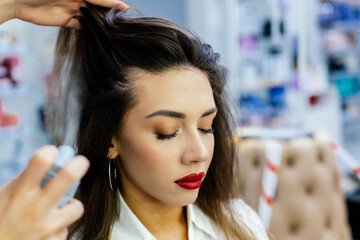 Fototapeta premium Beautiful brunette woman in a beauty salon.