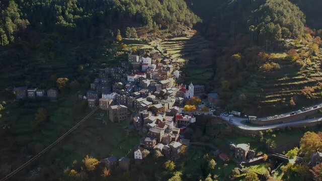 DRONE AERIAL FOOTAGE: The picturesque little schist villages of Piod&atilde;o clings to a steeply terraced mountainside deep within the foothills of the Serra de A&ccedil;or range in central Portugal. 