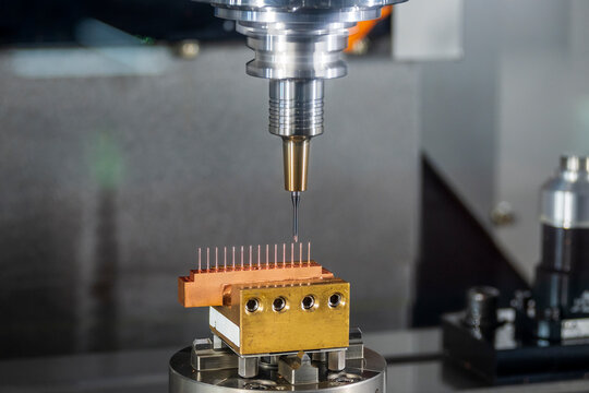The CNC milling machine cutting the  electrode parts with solid ball end mill tools.