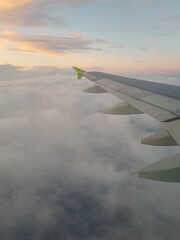 Fototapeta premium The plane flies among the clouds