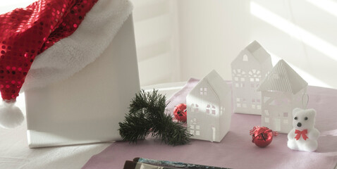 hand made gift and presents concept, white empty canvas, paper houses, decorations for new year and christmas