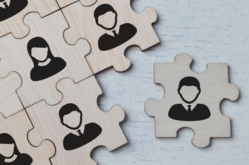 Choosing good employer leader. Wooden jigsaw puzzle with people figures