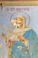 painting the walls of an abandoned temple