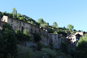 Old mountain village with stone houses and roofs