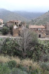 Fototapeta premium Abandoned mountain village houses. Ghost village. Old stone houses in abandoned village 