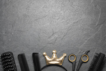 Vip hairdressing salon concept. Golden crown and hairdressing tools on the black flat lay...