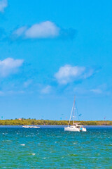 Panorama landscape view Holbox island turquoise water and boats Mexico.