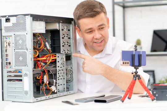 A Man Records A Video Lesson On Computer Repair Or Makes An Online Consultation.