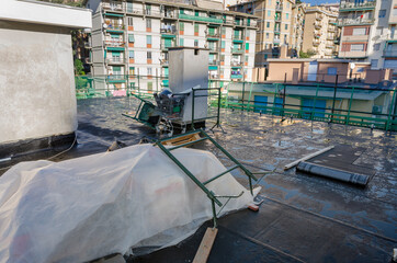 laying of waterproofing sheathing  and insulation during the renovation of a roof in Italy - 477009903