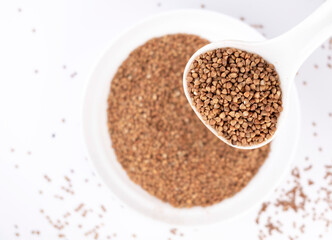 Buckwheat. Healthy food. Buckwheat spoon on white background