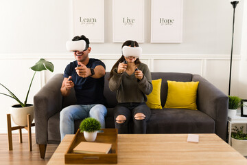 Woman and man enjoying VR games