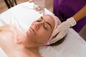 Receiving botulinum toxin injections