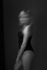 Monochrome portrait of young unrecongnizable ballerina dancer, motin blur effect, effect