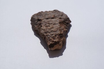 Ancient scraper made of flint from prehistorical time on white background