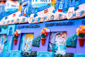 Chefchaouen, Morocco. October 10, 2021. Variety of small frame shaped design magnets for sale at local bazaar