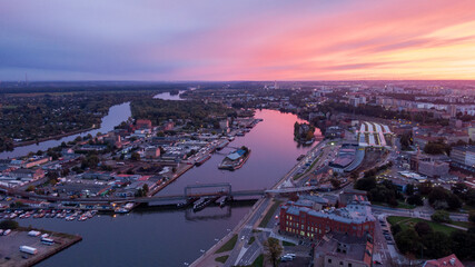 Szczecin, Poland : Beautiful Sunset over Odra river and Old Town, Aerial view of City - obrazy, fototapety, plakaty