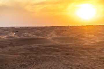 Naklejka na ściany i meble Shot of a dramatic sunset in the desert. Nature