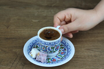 FEMALE HAND TAKE A CUP OF TRADİTİONAL TURKISH COFFEE