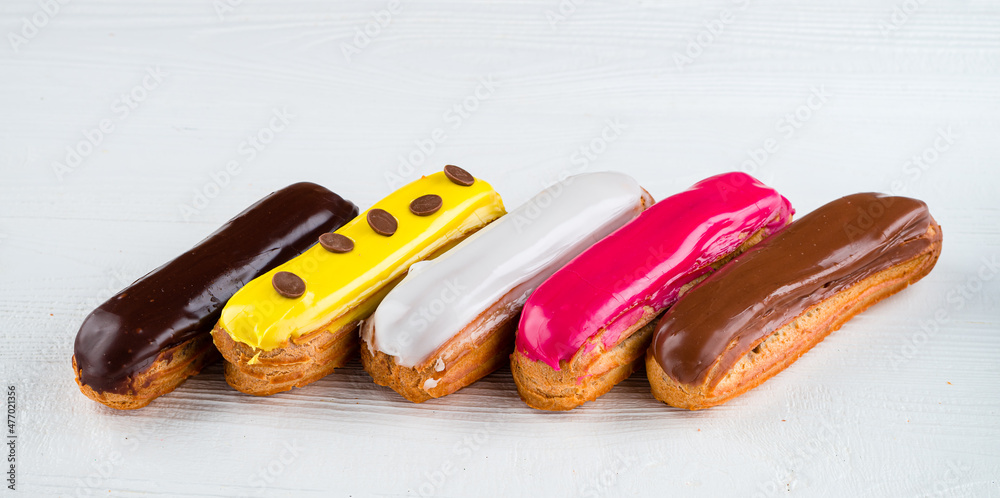 Poster multicolored glazed eclairs decorated. sweet dessert.