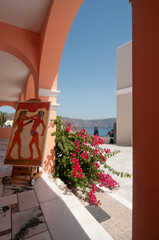 Porch with panoramic sea view, and an illustration of Greek mythology in Oia, Greece.