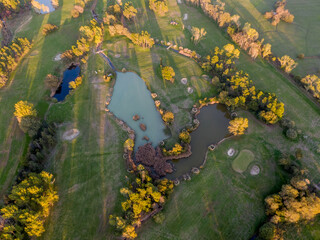 Fototapeta na wymiar Aerial view drone shot of beautiful golf field High angle view