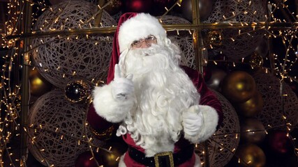 Funny Santa Claus is talking to the camera, wishing a Merry Christmas and a Happy New Year.