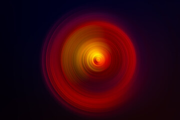 Abstract spiral- shaped  luminous multicolored texture on a black background .