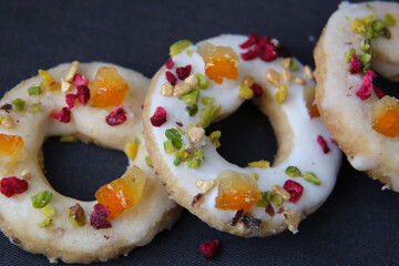 shortbread cookies with candied fruits on a dark background