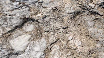 Grey stone background with white and ochre colours
