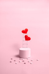 Podium with wooden stairs and hearts on a pink background, monochrome. Celebrating Valentine's Day copy space. Vertical format