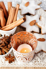 Gingerbread cookies in star shape decorated with almonds.