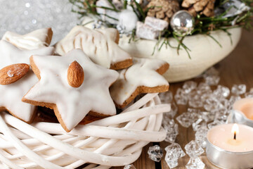 Fototapeta na wymiar Gingerbread cookies in star shape decorated with almonds.