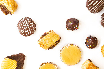 various chocolate covered cakes on white background