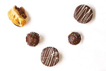 Chocolate covered cakes on white background